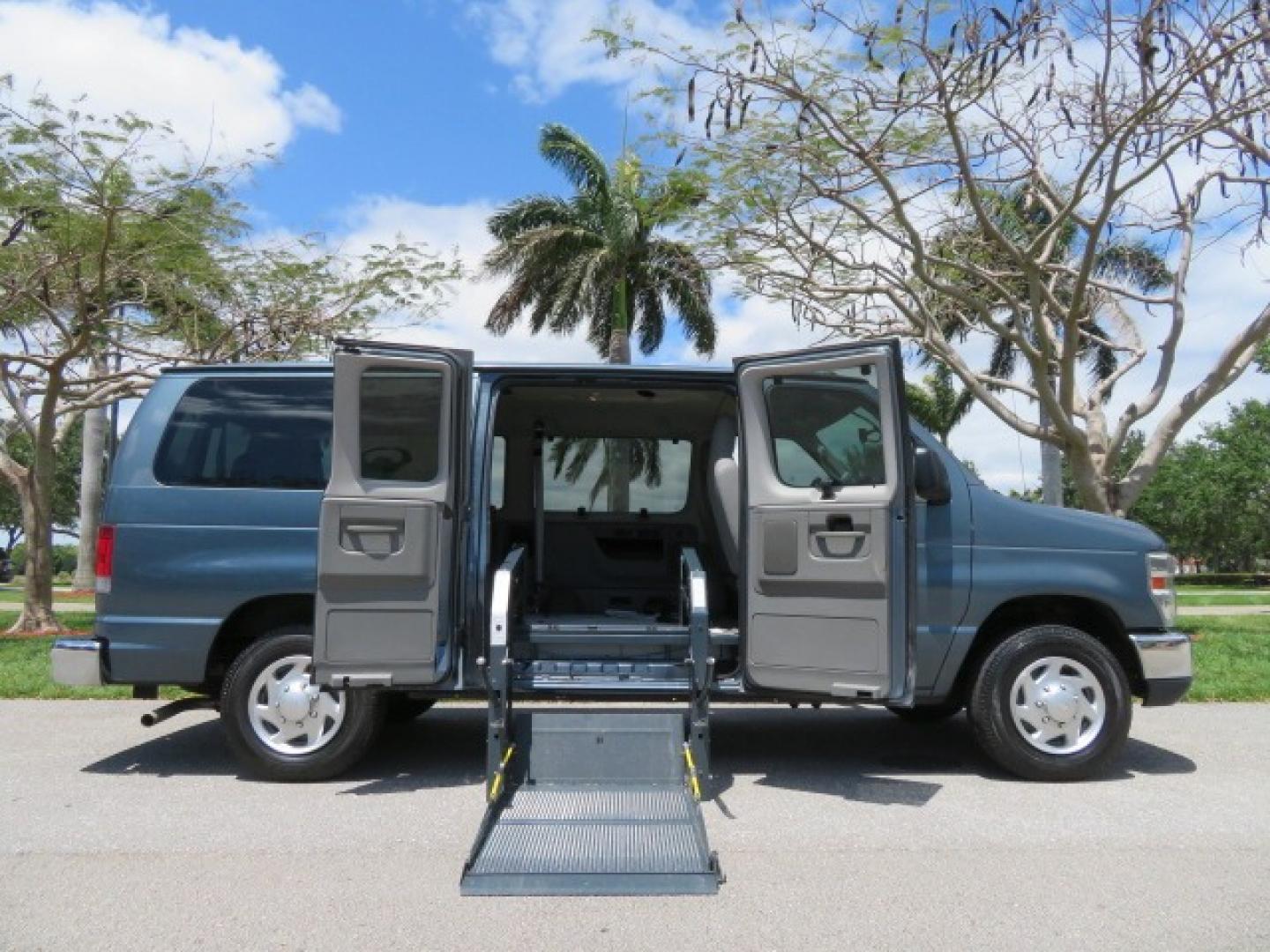 2013 Dark Blue /Gray Ford E-Series Wagon XLT (1FMNE1BW4DD) with an 4.6L V8 engine, Automatic transmission, located at 4301 Oak Circle #19, Boca Raton, FL, 33431, (954) 561-2499, 26.388861, -80.084038 - You are looking at a Gorgeous 2013 Ford E150 XLT Handicap Wheelchair Conversion Van with 22K Original Miles, Tie Down System, Power Electric VMI Side Entry Wheelchair Lift, Back Up Camera, Factory Navigation and Much Much More. This van is Awesome. This is a Nice Rust Free Van with a Clean Carfax, C - Photo#0